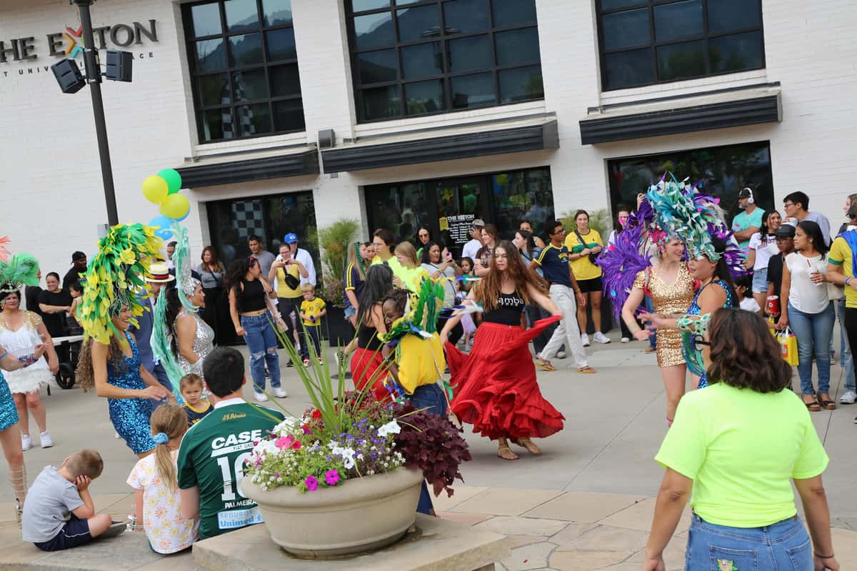 Dancers celebrating a community event hosted by Tucanos Brazilian Grill
