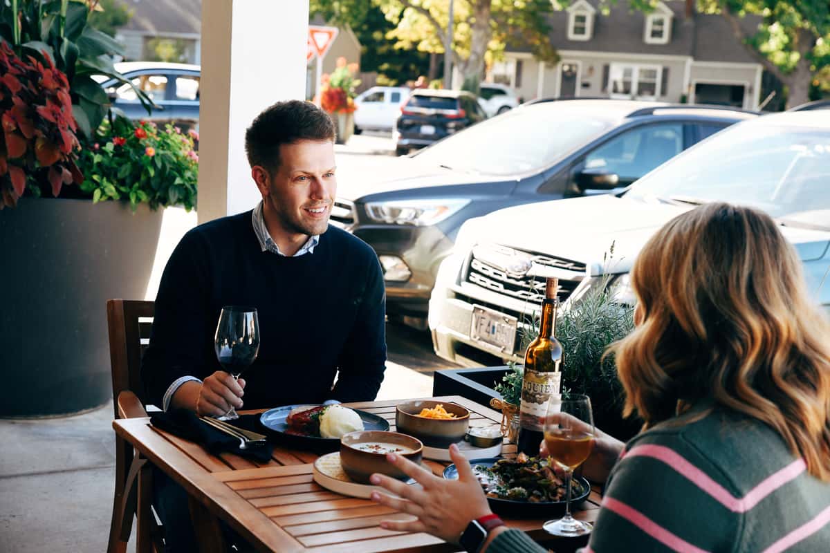 Two guests dining outside of Scratch Gourmet Kitchen