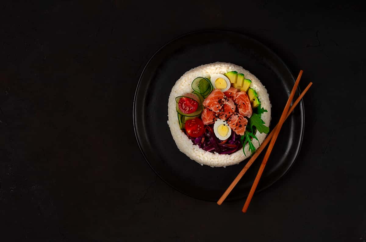 Poke bowl with salmon rice and vegetables