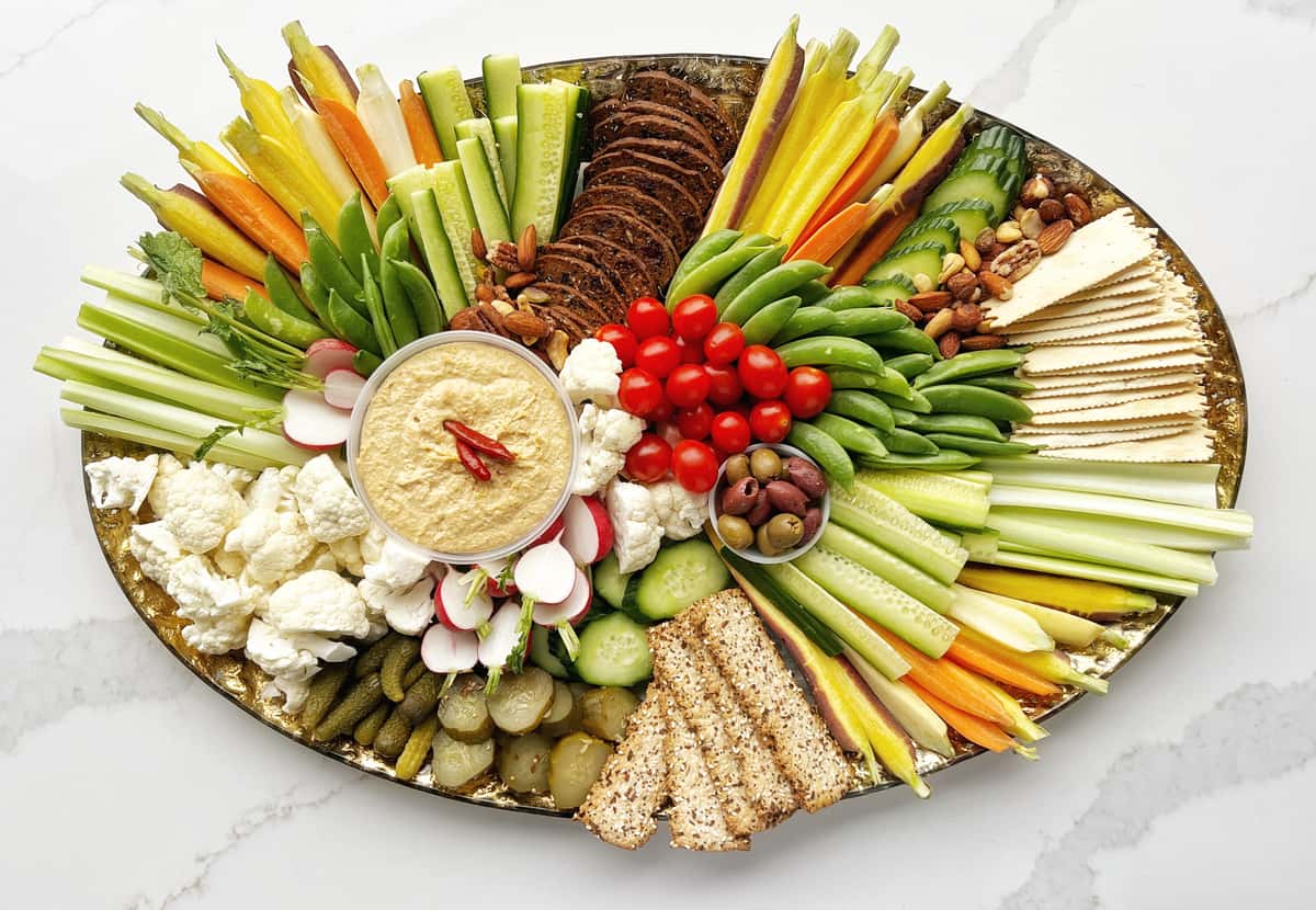 Fresh crisp vegetables, artisanal crackers, fresh Fare hummus