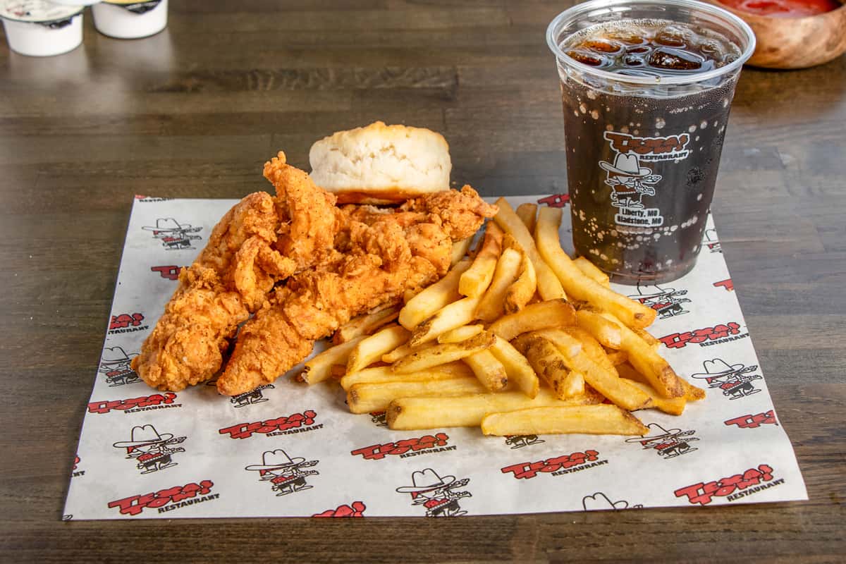 Texas Tom's four-piece crispy chicken tender combo with fries, a biscuit, and a soft drink