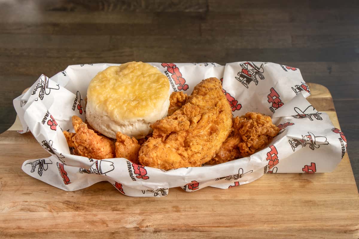 Texas Tom's four-piece crispy chicken tenders served with a warm biscuit