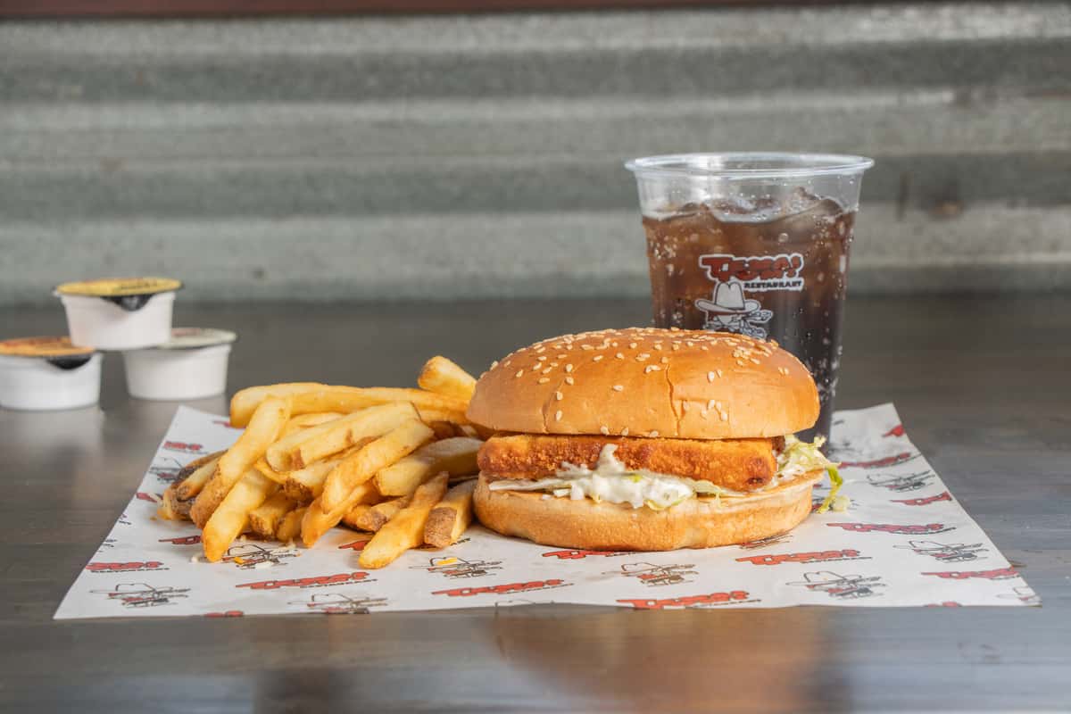 Texas Tom's crispy fish sandwich combo with fries and a drink