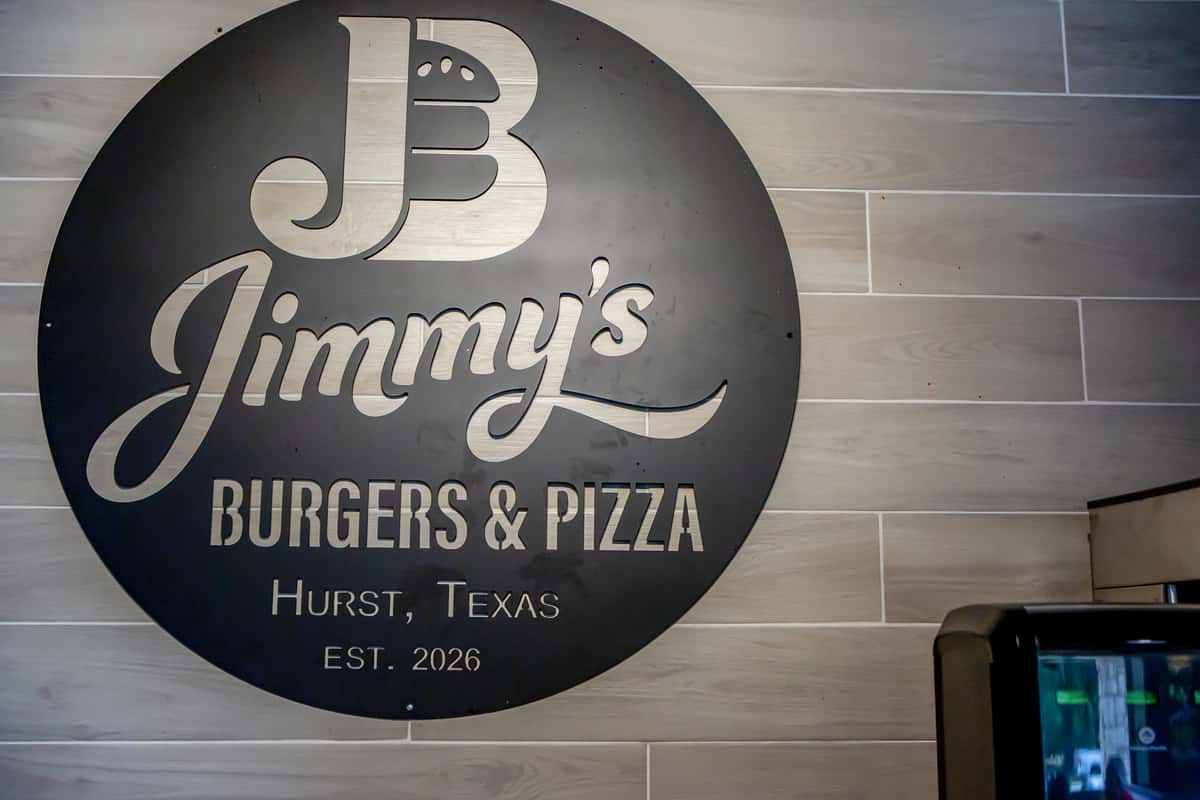 Casual dining area inside Jimmy's Burgers & Pizza restaurant in Hurst, TX