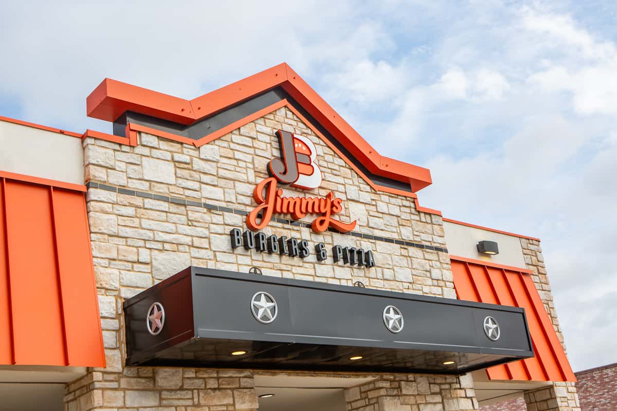 Jimmy's Burgers & Pizza storefront and restaurant sign in Hurst, TX