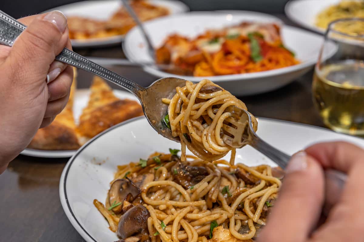 Close up of new lunch pasta being twirled around fork