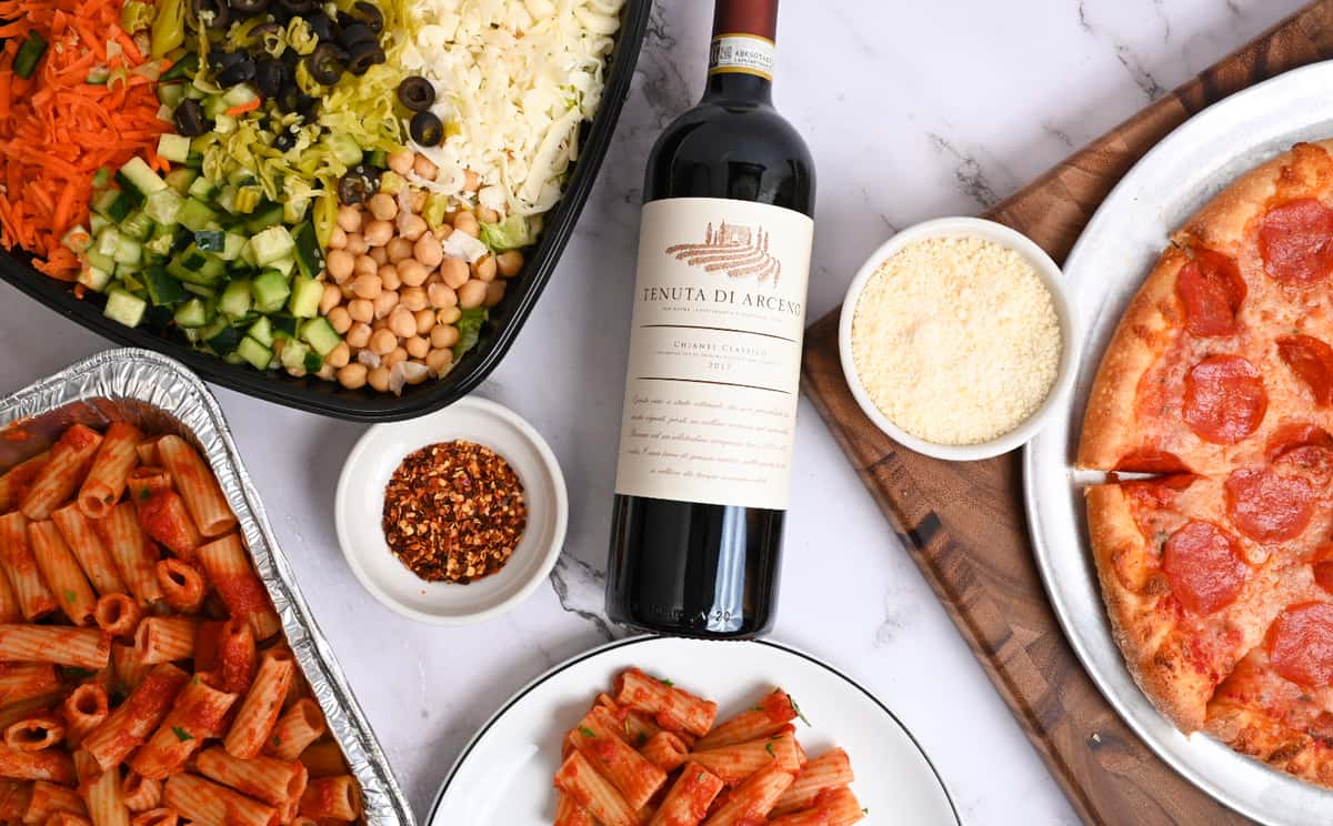 A picture of our pasta marinara family meal and a bottle of wine
