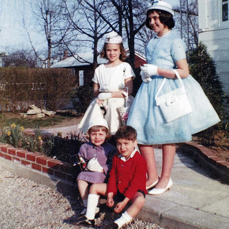 Photo of Maddy as a child with her siblings, dressed for Easter in Sunday bests with matching bonnets