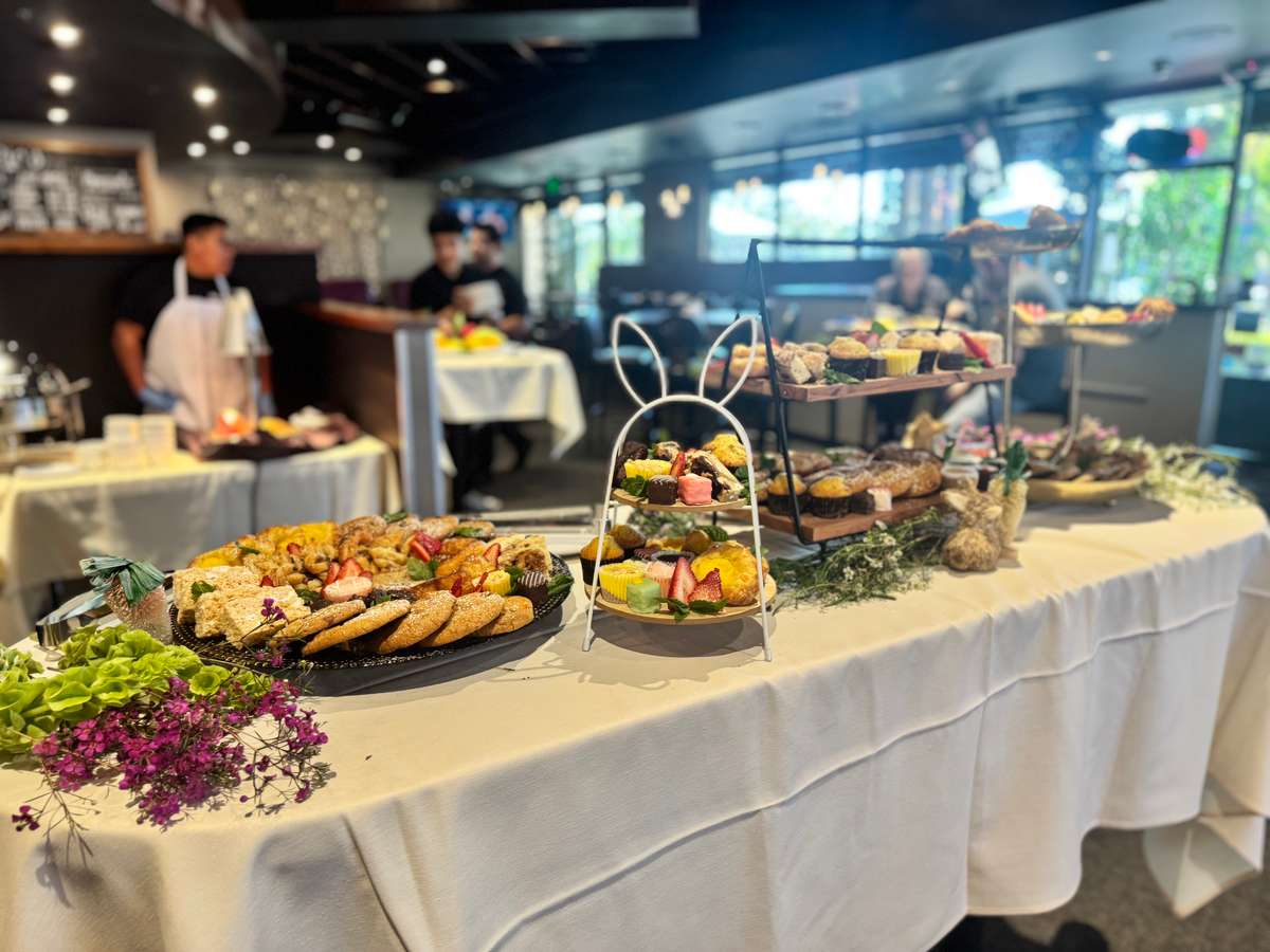 Catering platters and meals on a table spread at the restaurant