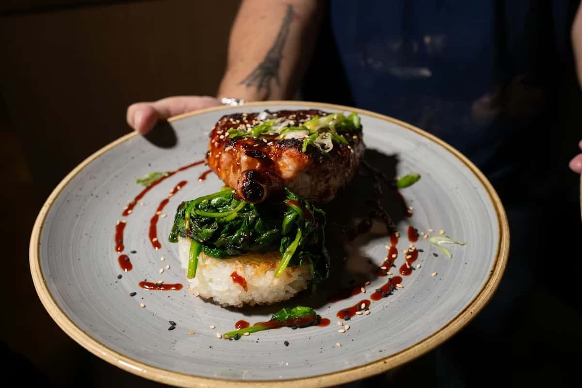 Pork chop with greens and rice