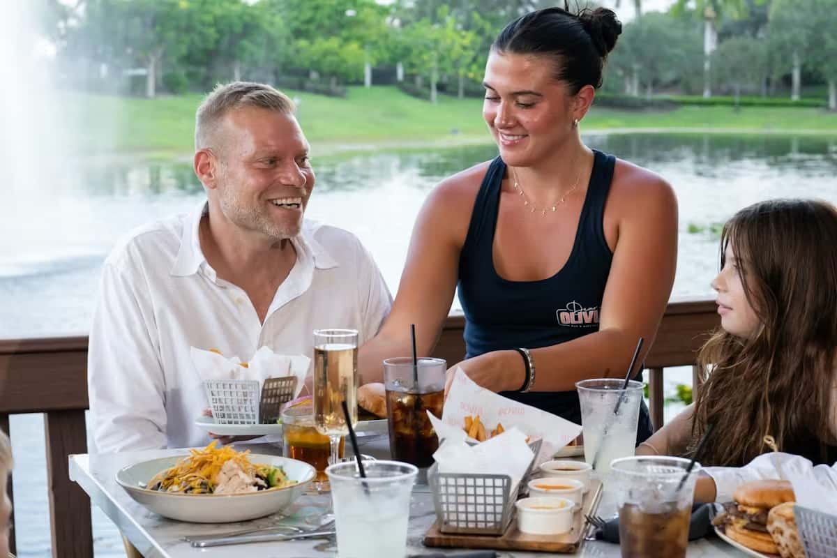 Waitress serving guests