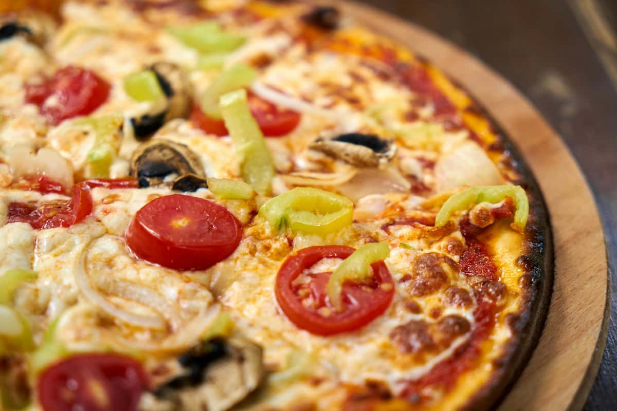 pizza with tomato, cheese and more