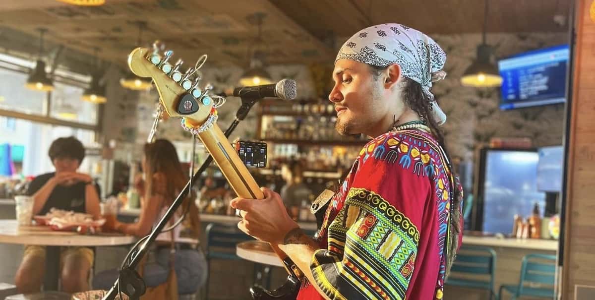 Musician Jake Menendez playing to crowd at Zunzibar