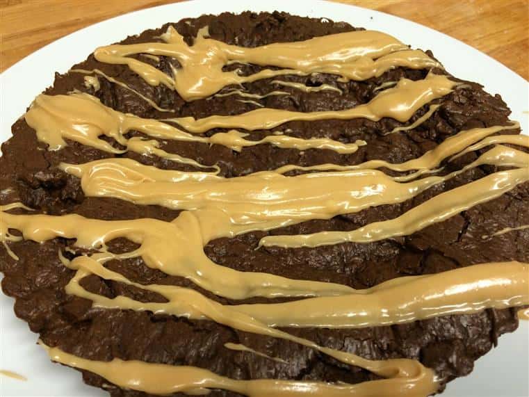 chocolate cookie drizzled with icing