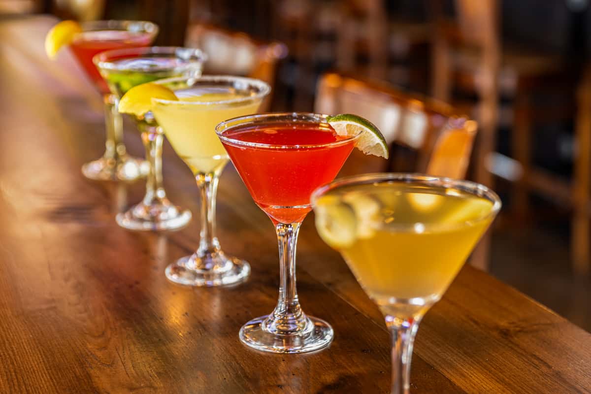 colorful assortment of martini cocktails served in elegant glasses on a bar counter