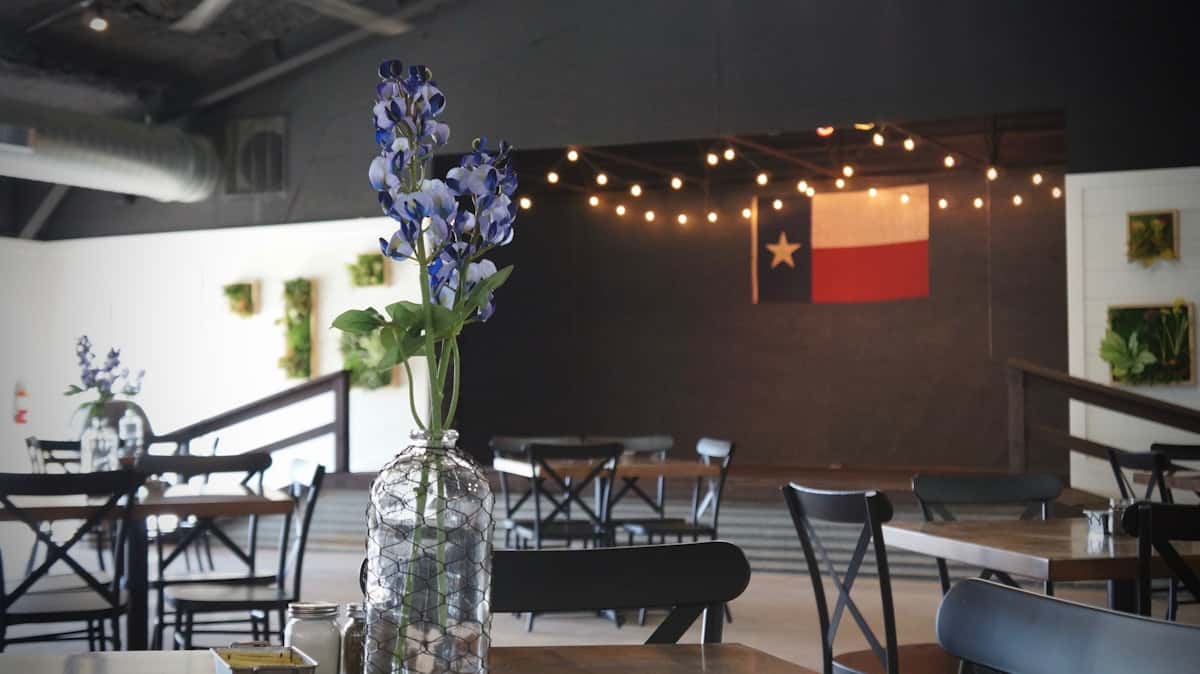 Texas bluebell in vase in restaurant dining room