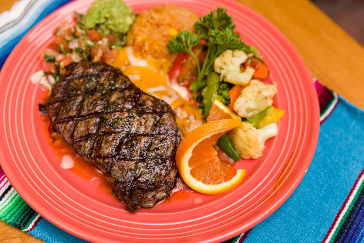 steak with orange slice