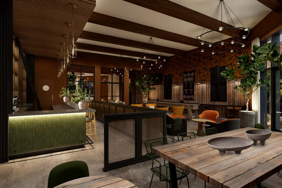 Chic bar with warm wood finishes, inviting seating, and ambient lighting at Scout Bar & Grill, providing a cozy space to enjoy global comfort food and local beverages.