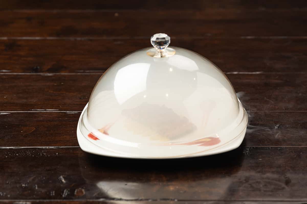 dish of food with glass cover