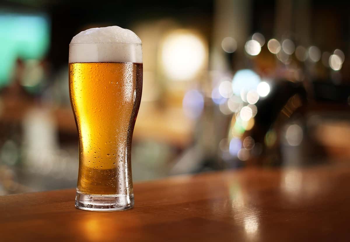 full glass of beer on a table