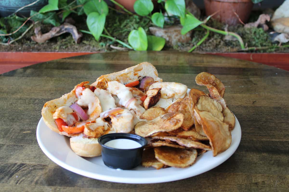 Grilled strips of chicken marinated in our Buffalo sauce, sauteed with red peppers and onions, and topped with melted provolone cheese