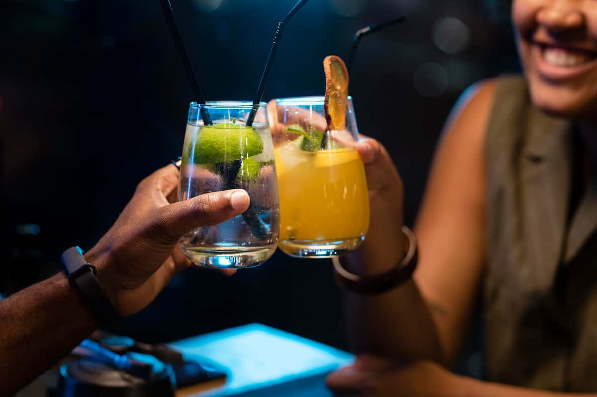 friends clinking drinks