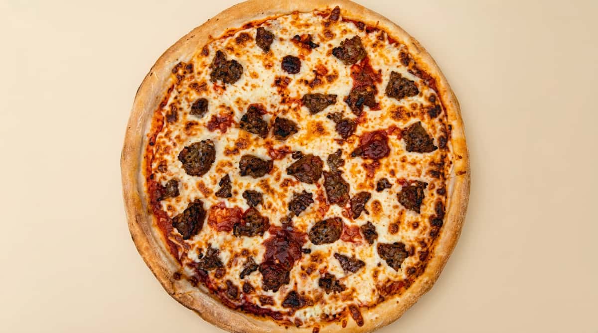 cheese pizza with browned mozzarella and crumbled sausage on a classic crust