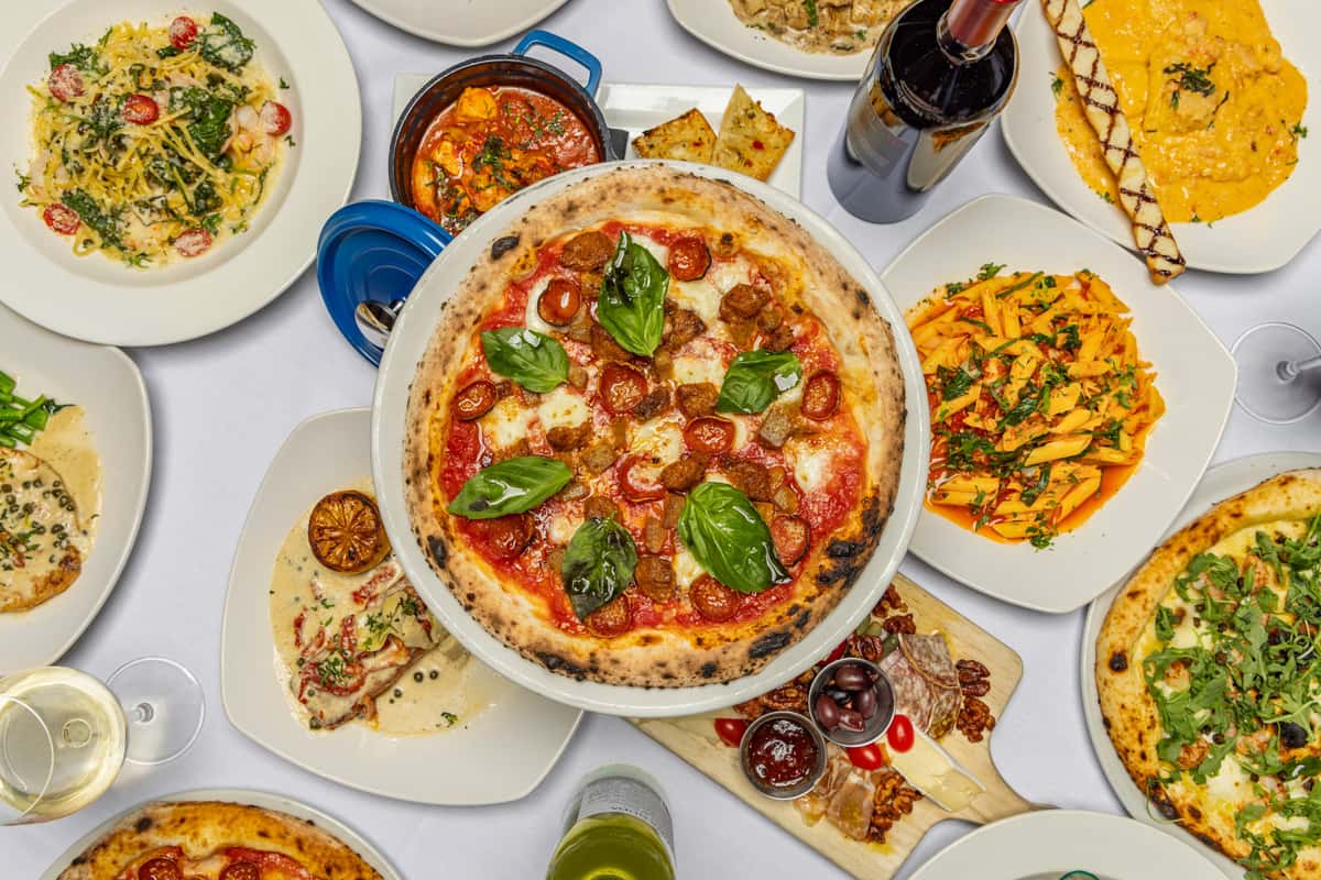 Group shot of food including pizza and more