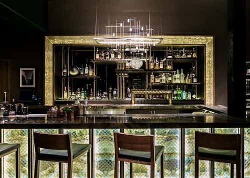 bar with wine display and ambient lighting