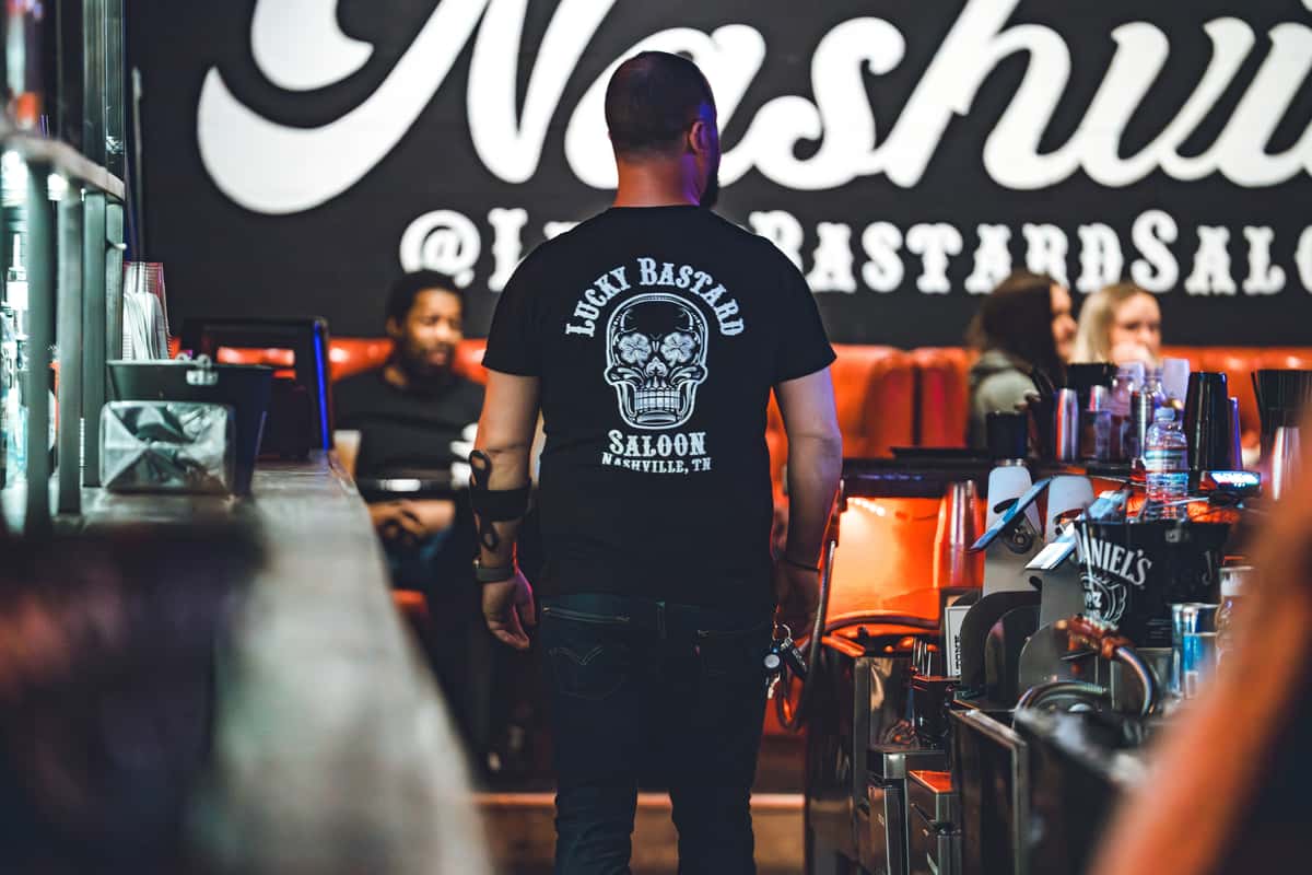 man wearing Lucky bastard Shirt