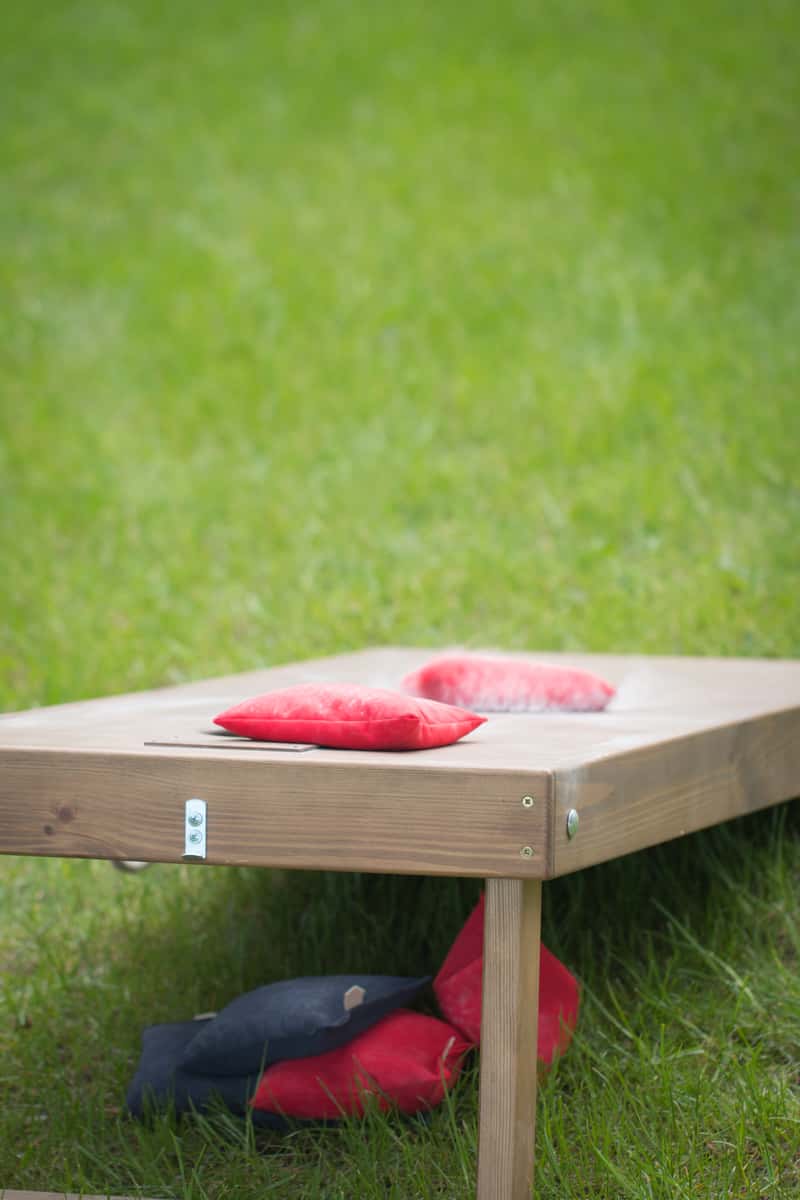 cornhole board with bean bags