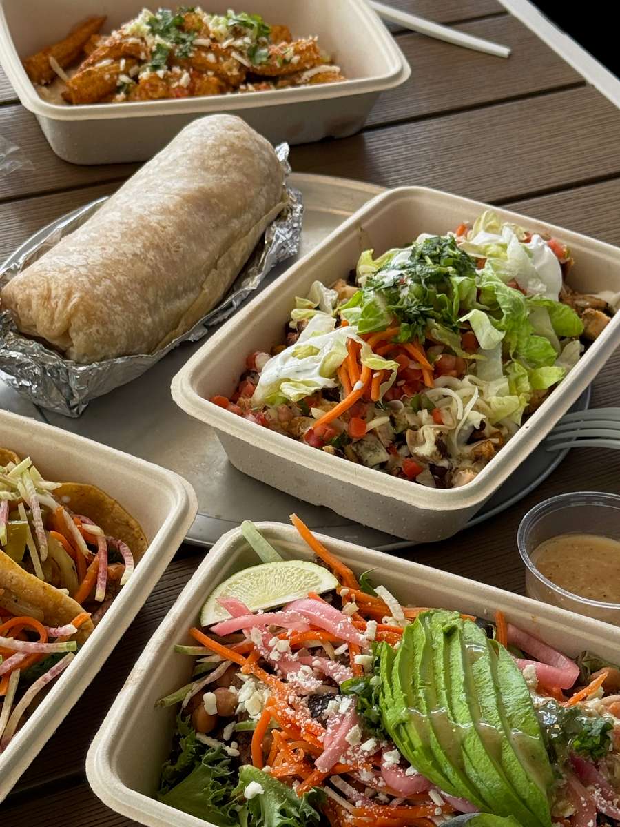 Two Step Taqueria individually packaged catering meals with a burrito, bowls and salad in Austin