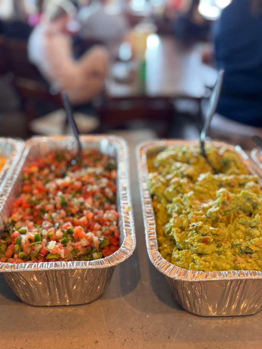 Two Step Taqueria catering trays with pico de gallo and guacamole in Austin