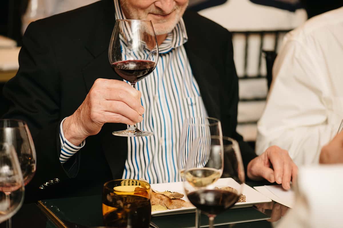 Gentleman enjoying a glass of red wine