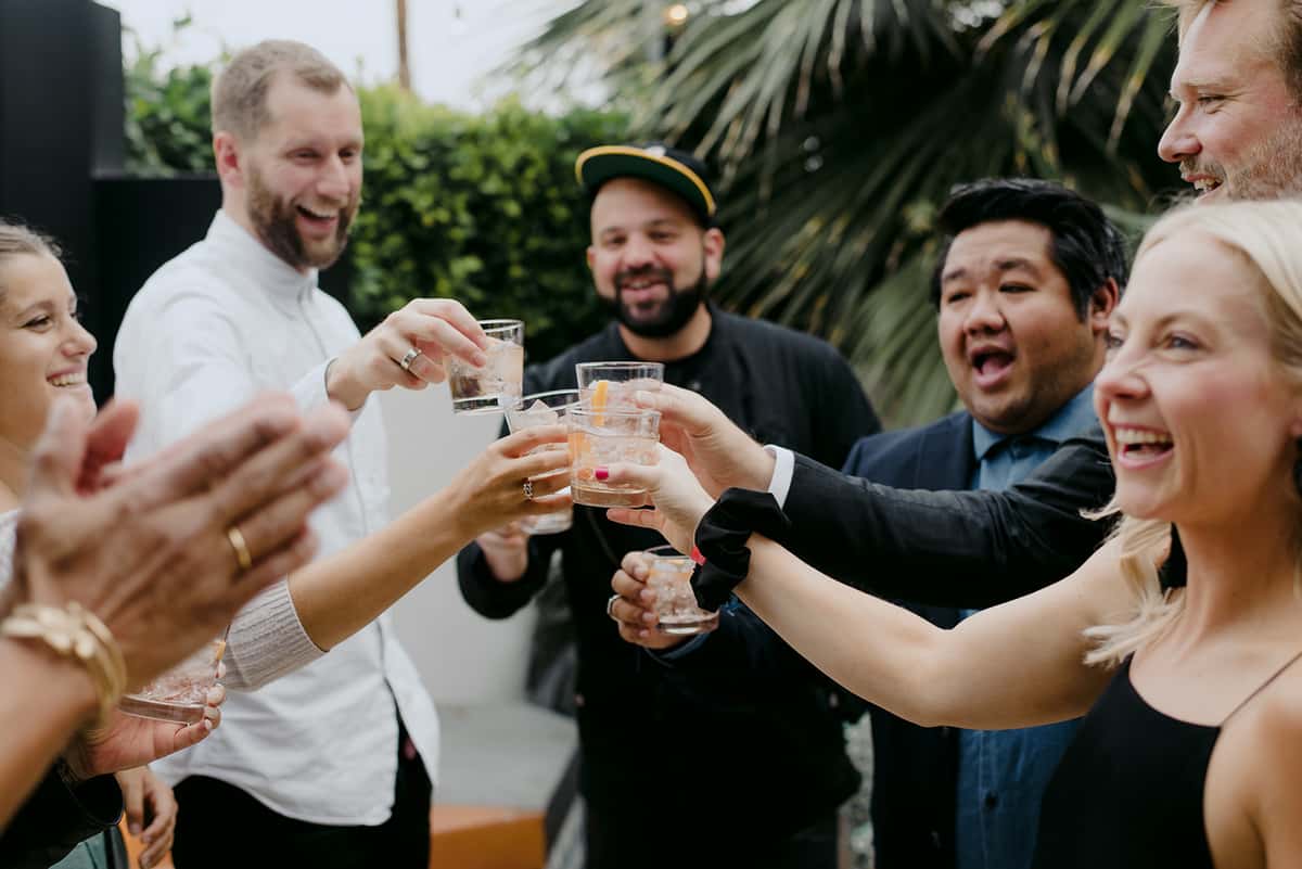 Group toasting with cocktails