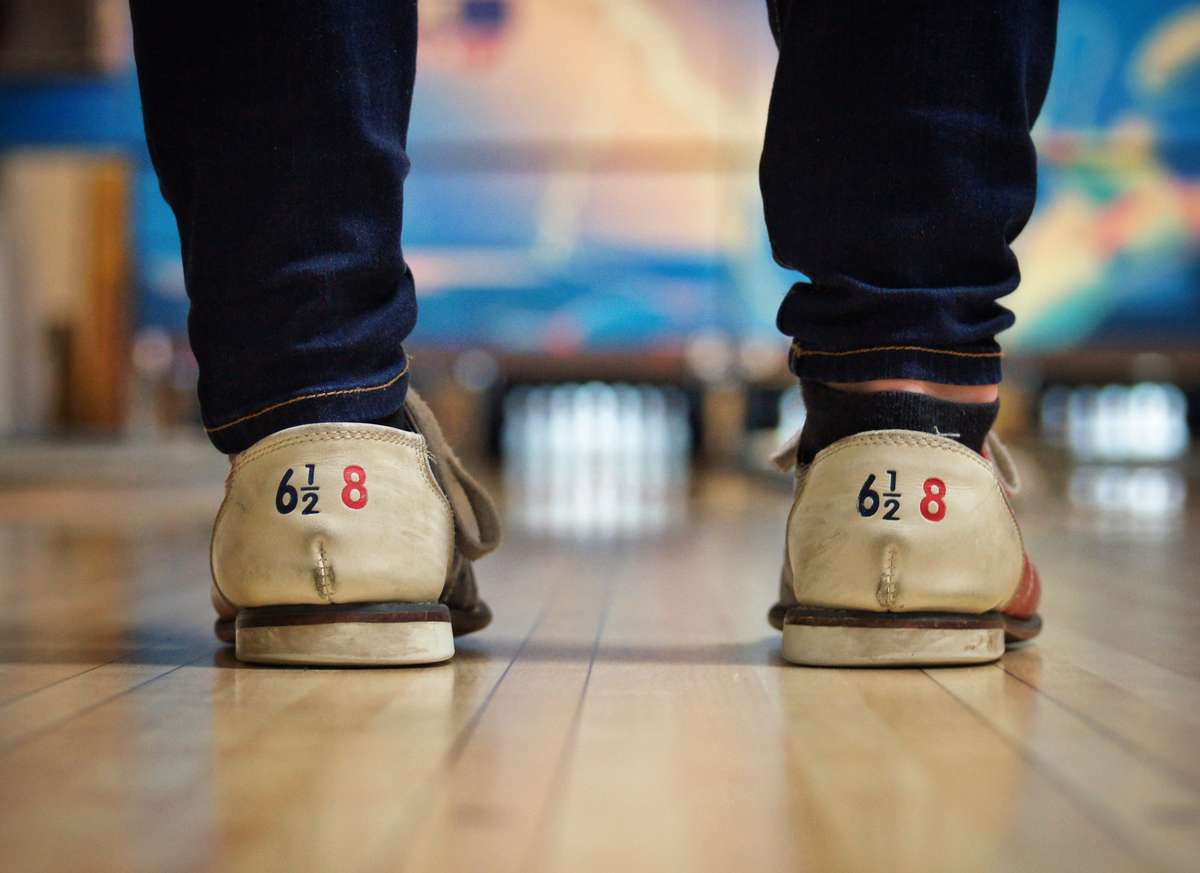 guest wearing bowling shoes
