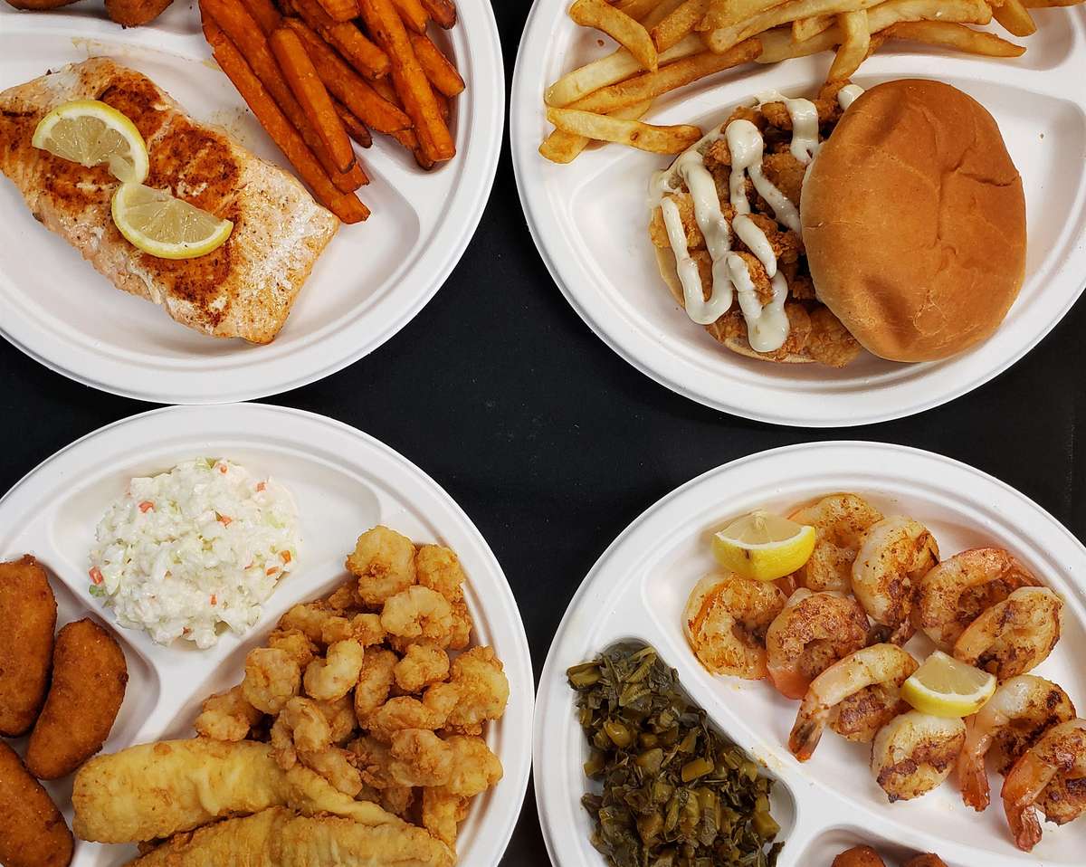 4 plates of different fried fish meals with sides such as spinach, sweet potato fries, and French fries.