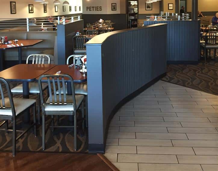 tables and chairs inside restaurant