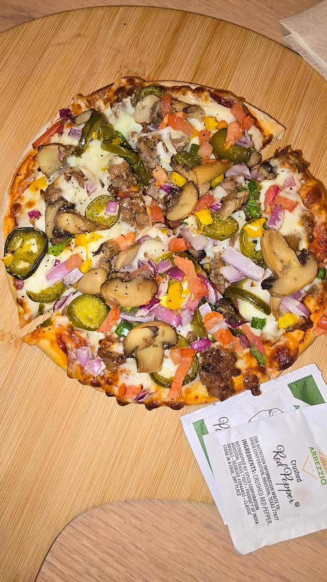 Pizza with toppings on it