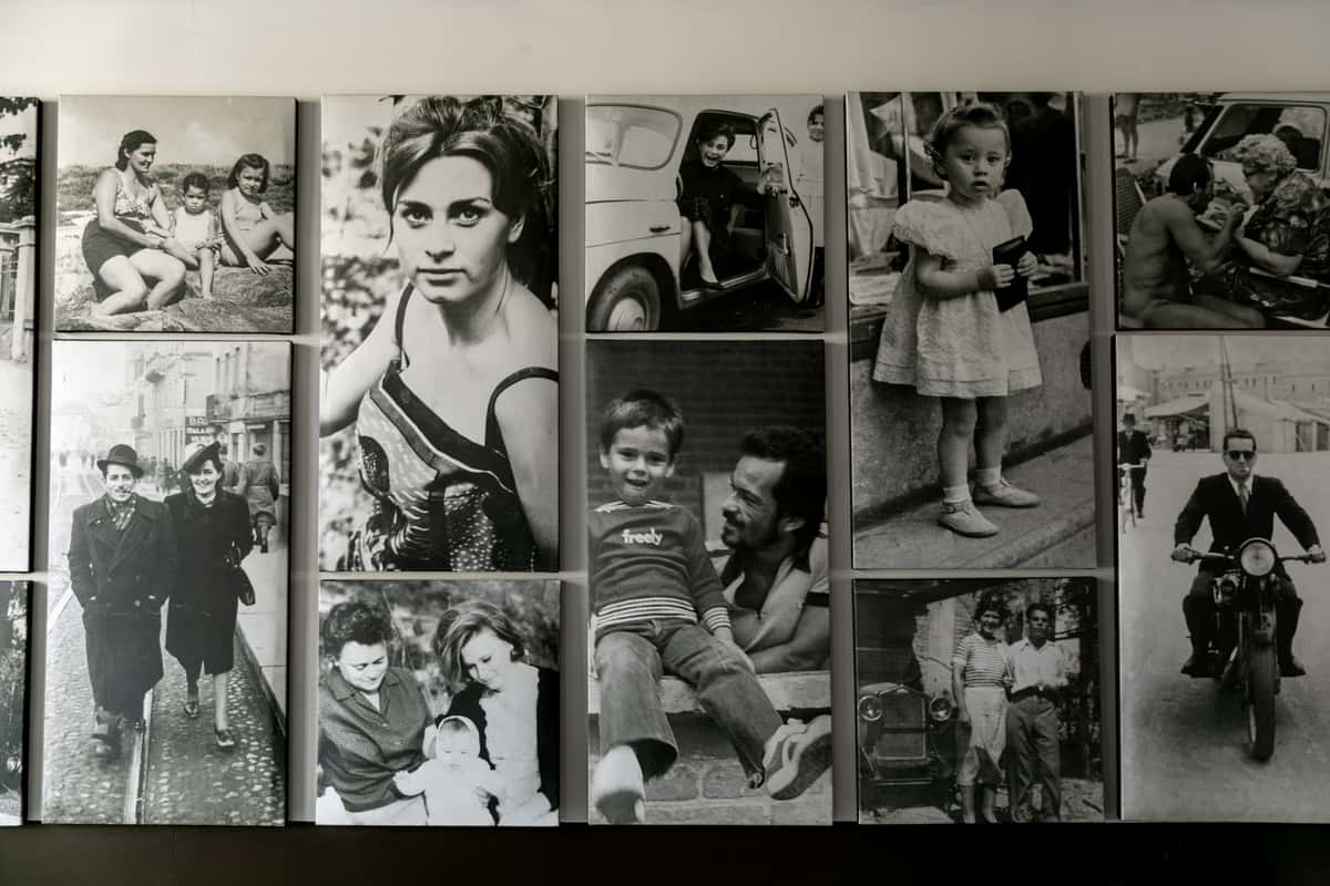 Interior decor of black and white photographs laid out in a masonry style