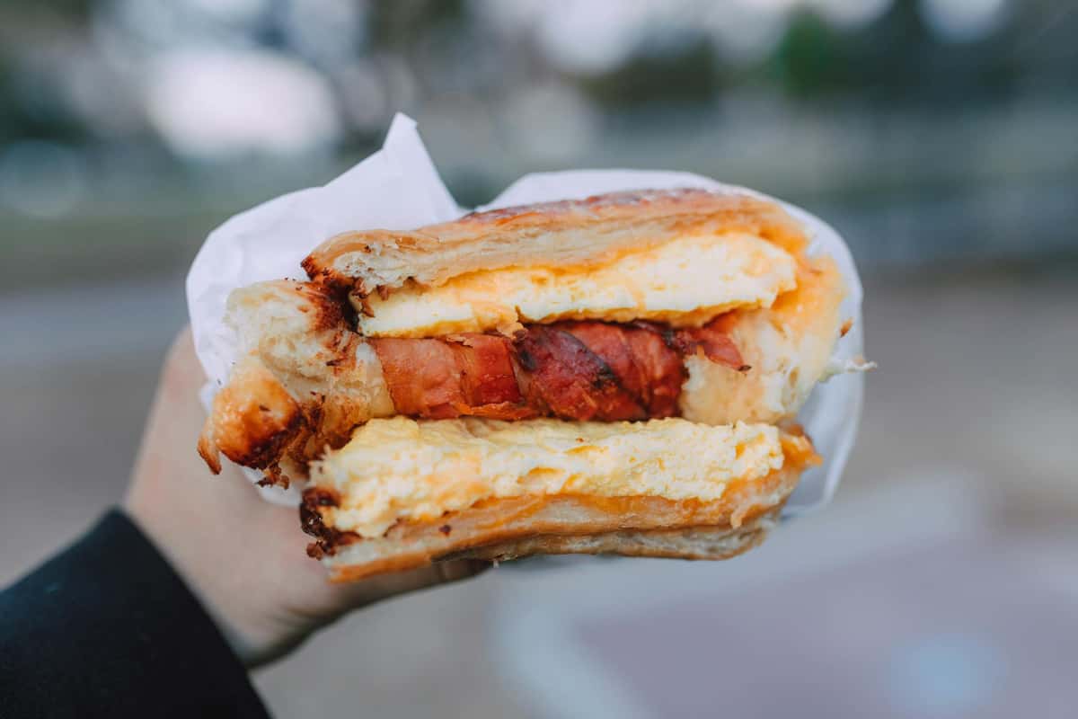 Holding up a sandwich