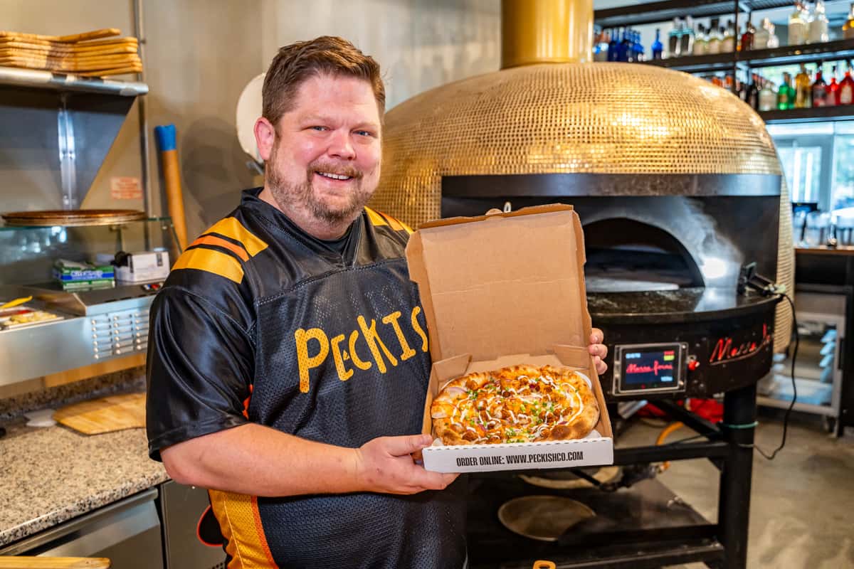 holding pizza box
