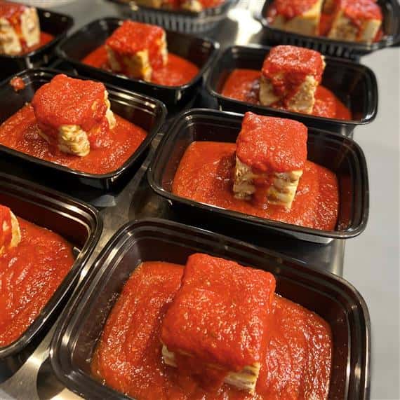 assortment of lasagnas in to-go containers