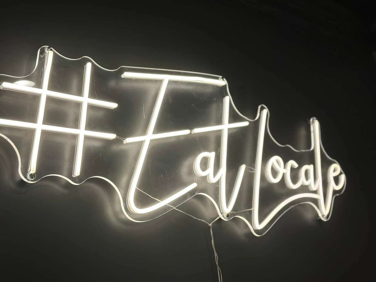 Neon Eat Local sign at The Locale in Brownsburg