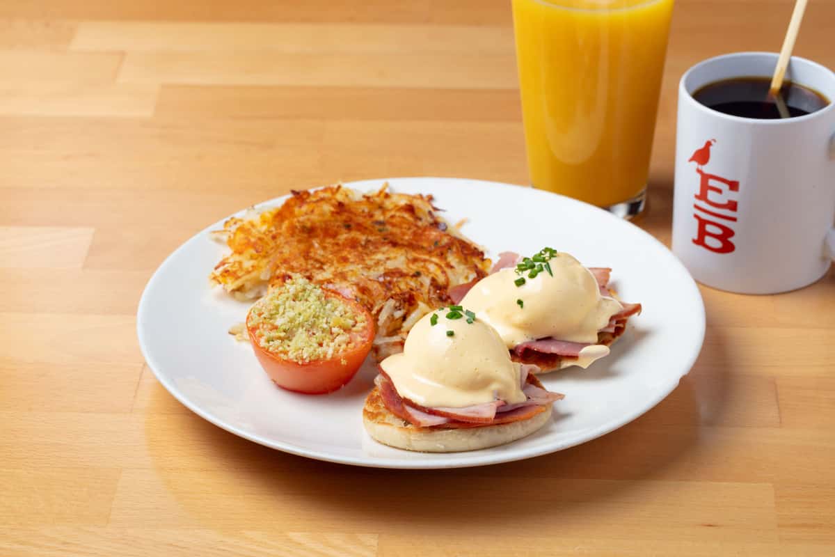 Eggs benedict with hollandaise served on a brunch plate
