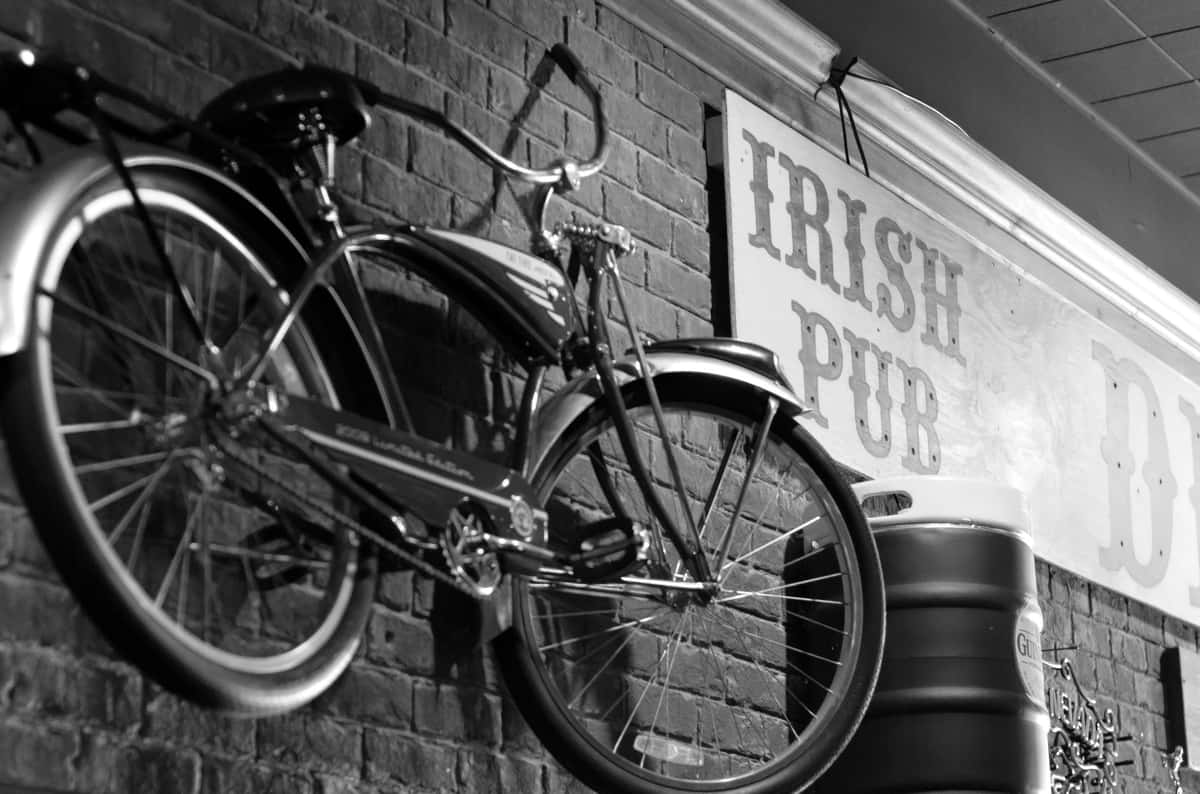 brick wall with signs and vintage bicycle