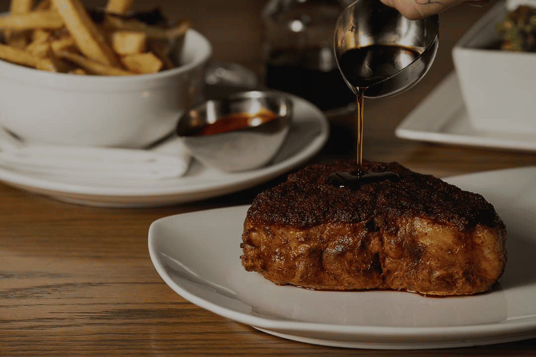 steak with wine and sides