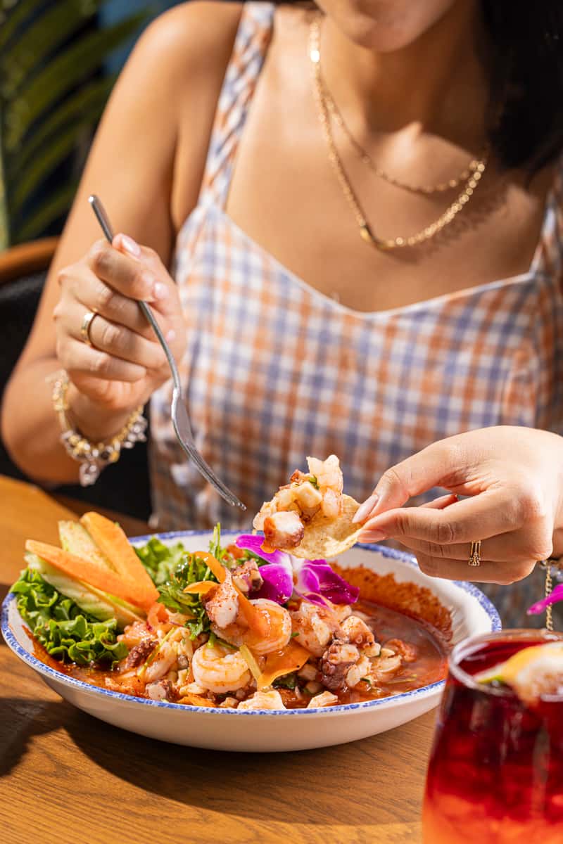 Guest enjoying a seafood dish at Costa Pacífica