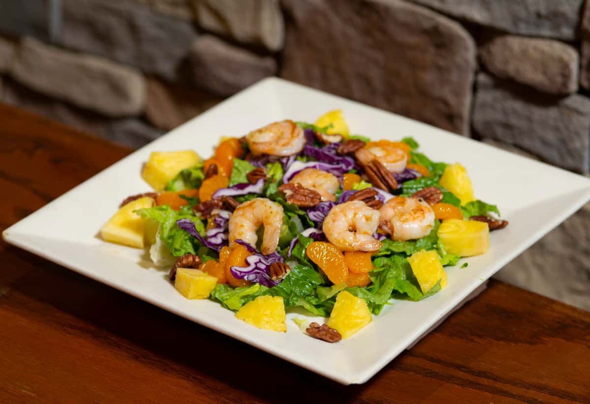 Your choice of chicken, steak, tilapia or shrimp, served on a bed of Romaine lettuce, cabbage, peaches, pineapple, and pecans.