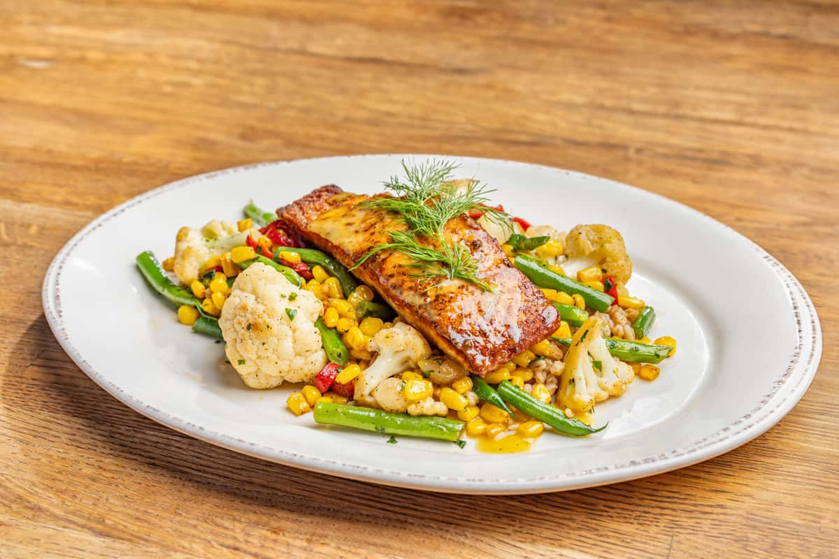 Salmon entree with a vegetable medley